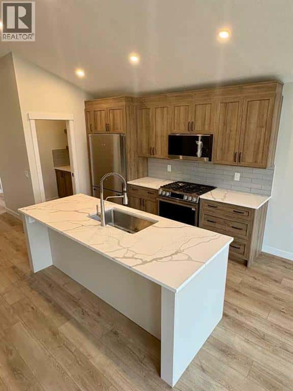 679 Anderson Close NW — Diamond Valley, Alberta - Photo 3 of 16