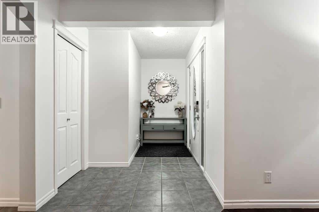 21 Mckinnon Street NW — Langdon, Alberta - Photo 5 of 46