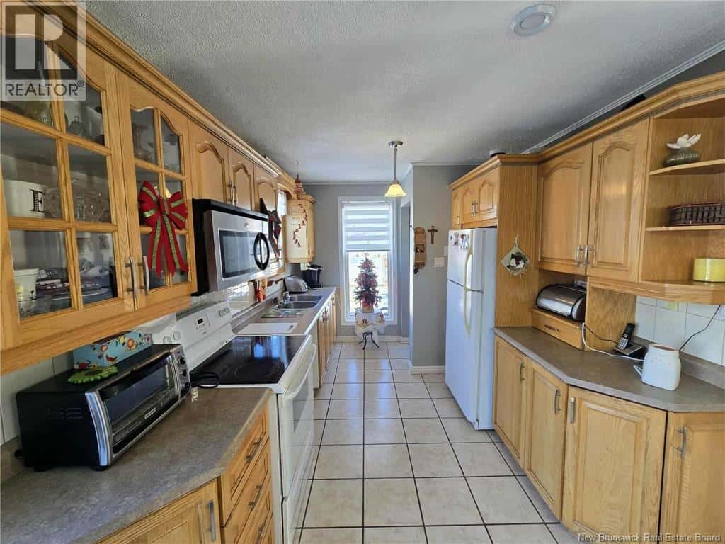 210 Francine — Beresford, New Brunswick - Photo 3 of 39