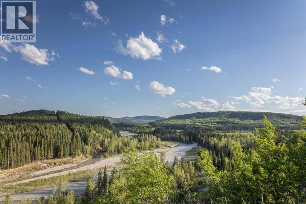 231175 Bracken Road — Bragg Creek, Alberta - Photo 2 of 34