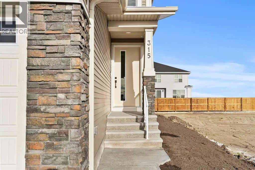 315 Kinniburgh Loop — Chestermere, Alberta - Photo 2 of 50