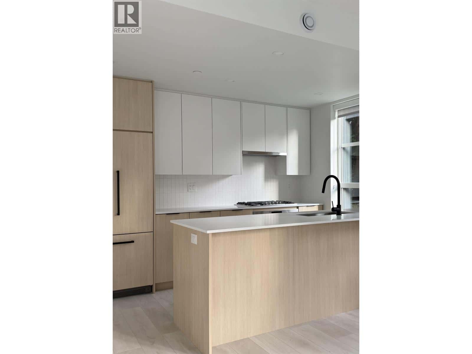 210 2045 HERITAGE PARK LANE — North Vancouver, British Columbia - Photo 4 of 15