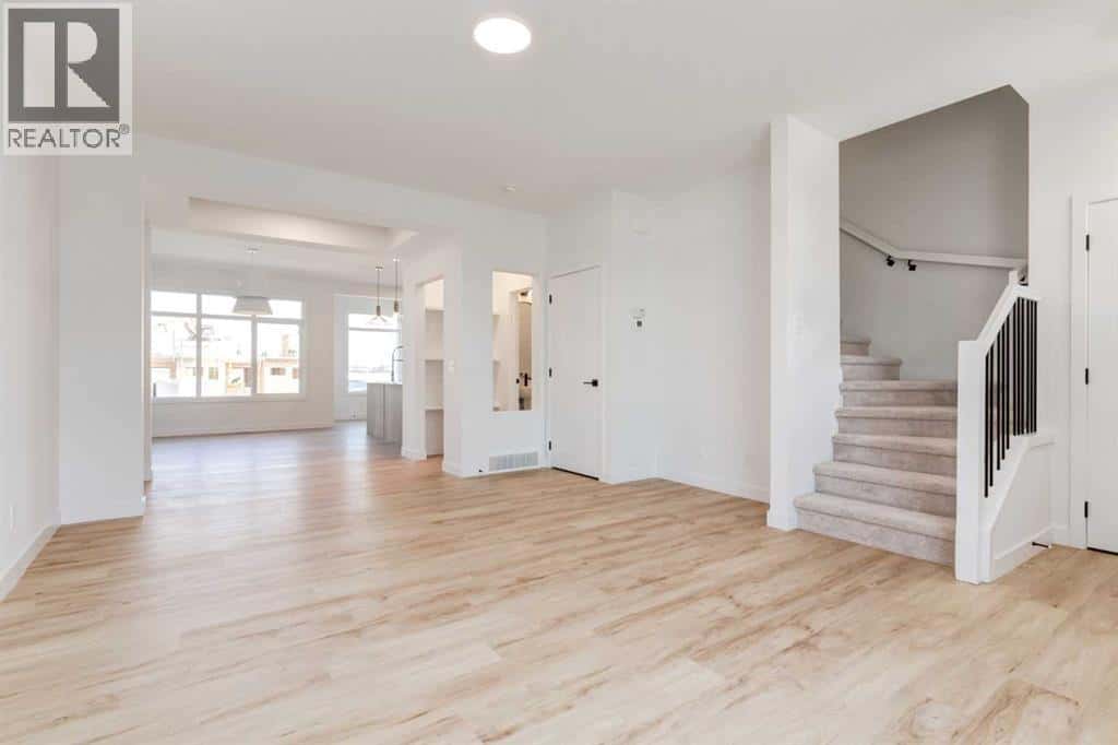 201 Tillotson Drive — Okotoks, Alberta - Photo 4 of 25