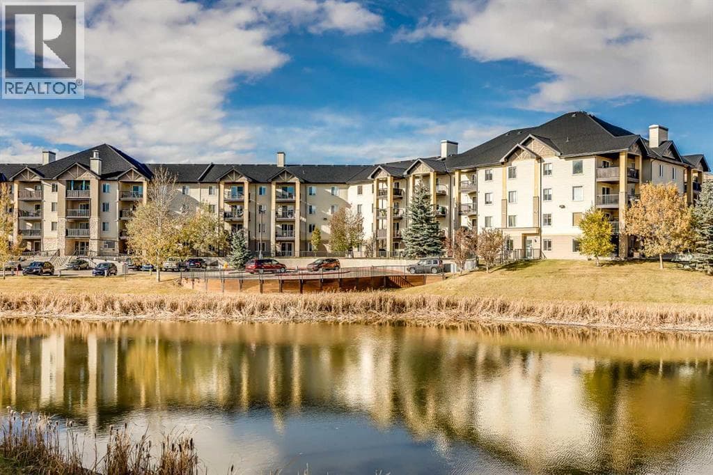 8128, 304 Mackenzie Way SW — Airdrie, Alberta - Main photo