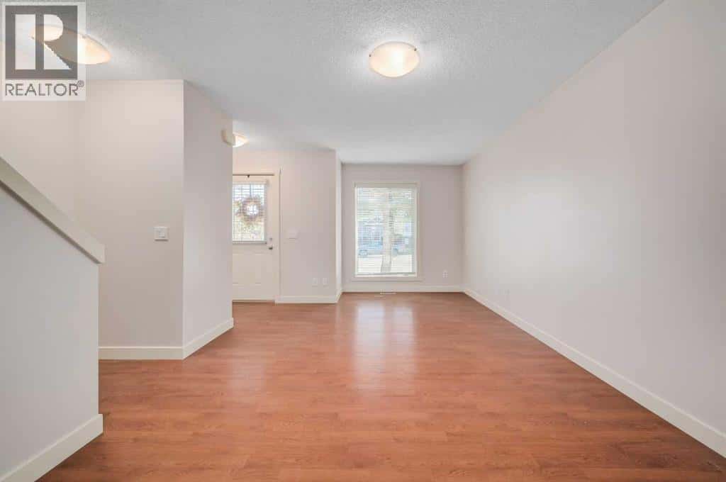 1203, 2445 Kingsland Road SE — Airdrie, Alberta - Photo 2 of 26