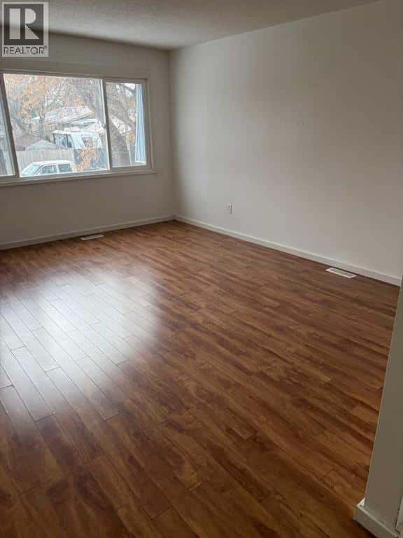 1023 Cassils Road W — Brooks, Alberta - Photo 3 of 10