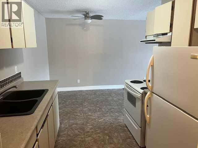 48 SUITES, 4607/4609 51 Avenue — Whitecourt, Alberta - Photo 5 of 18