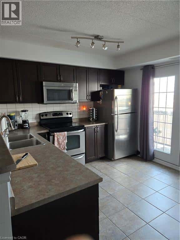 1390 MAIN Street E Unit# 305 — Milton, Ontario - Photo 4 of 28
