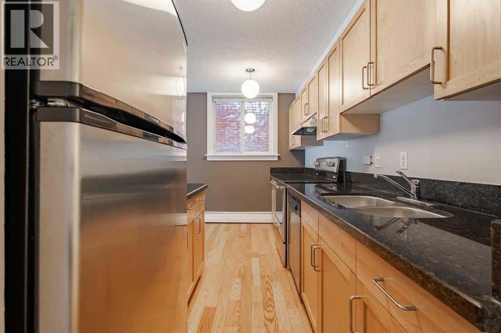 105, 934 2 Avenue NW — Calgary, Alberta - Photo 4 of 27