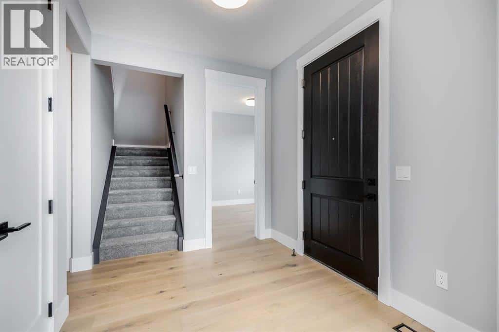 1209 Coopers Drive SW — Airdrie, Alberta - Photo 3 of 33