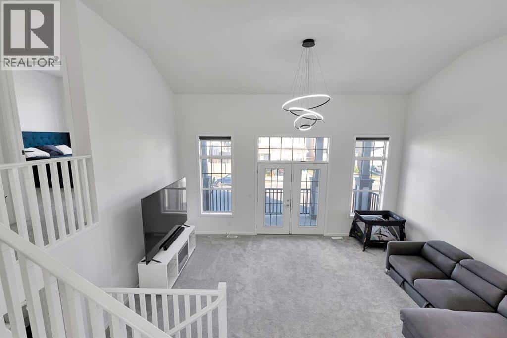 4168 Windsong Boulevard SW — Airdrie, Alberta - Photo 4 of 48