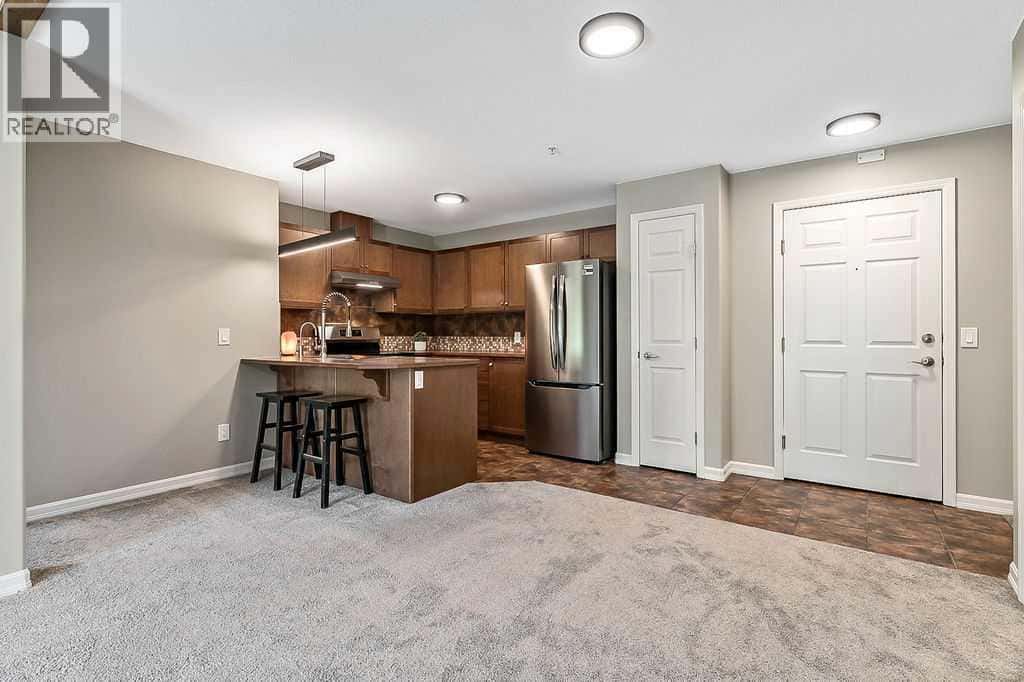 2105, 92 Crystal Shores Road — Okotoks, Alberta - Photo 5 of 44