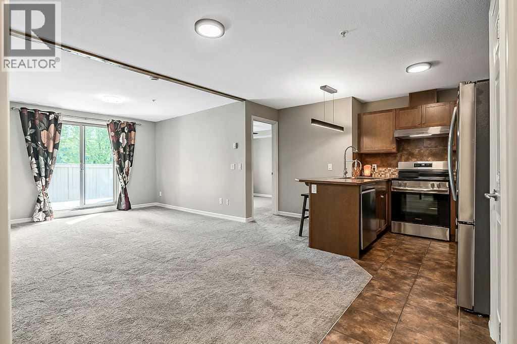 2105, 92 Crystal Shores Road — Okotoks, Alberta - Photo 4 of 44