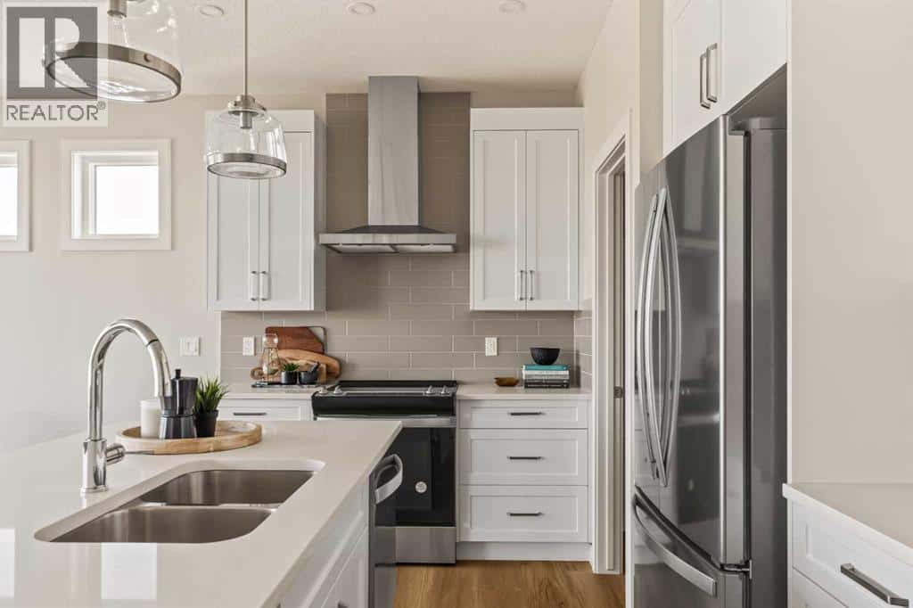 1168 Iron Ridge Avenue — Crossfield, Alberta - Photo 4 of 50