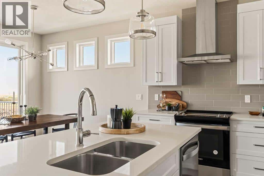 1168 Iron Ridge Avenue — Crossfield, Alberta - Photo 5 of 50