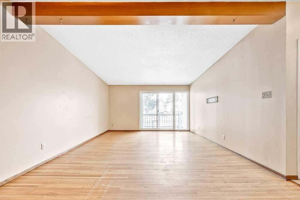 706 68 Avenue SW — Calgary, Alberta - Photo 5 of 26