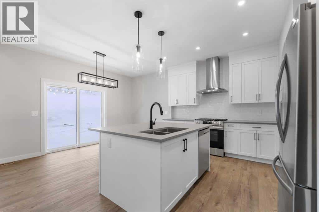 1067 Fowler Road SW — Airdrie, Alberta - Photo 3 of 29