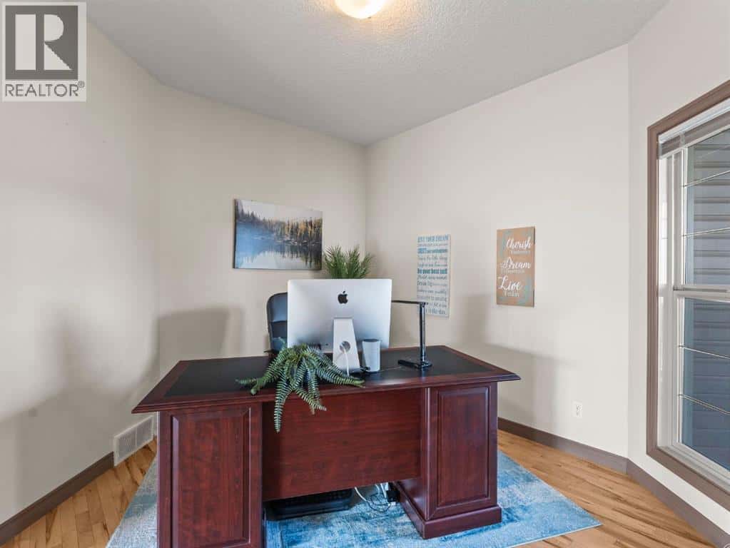 95 Crystal Shores Road — Okotoks, Alberta - Photo 4 of 40