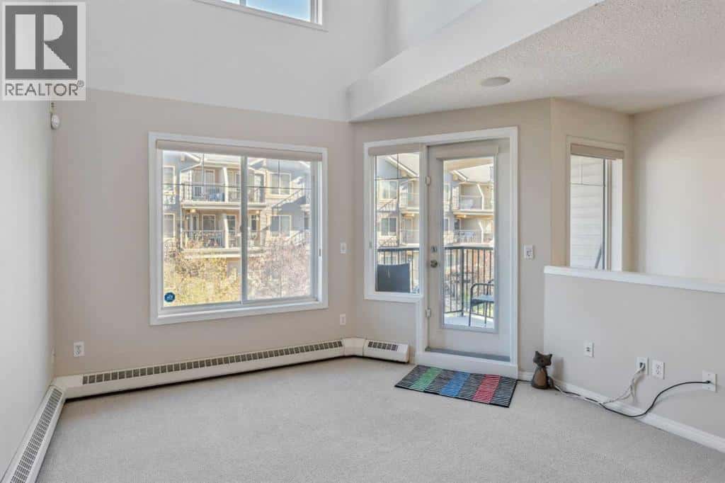 229 Mckenzie Towne Lane SE — Calgary, Alberta - Photo 3 of 24