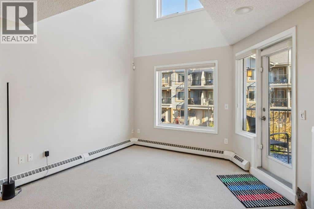 229 Mckenzie Towne Lane SE — Calgary, Alberta - Photo 4 of 24