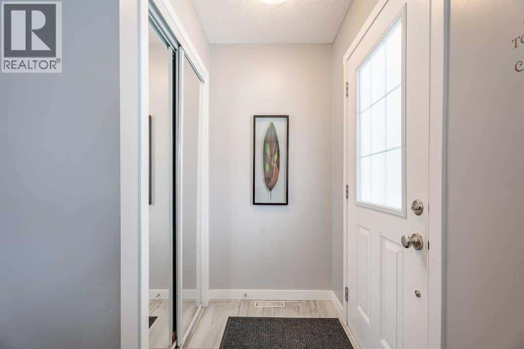 3098 Windsong Boulevard SW — Airdrie, Alberta - Photo 4 of 36