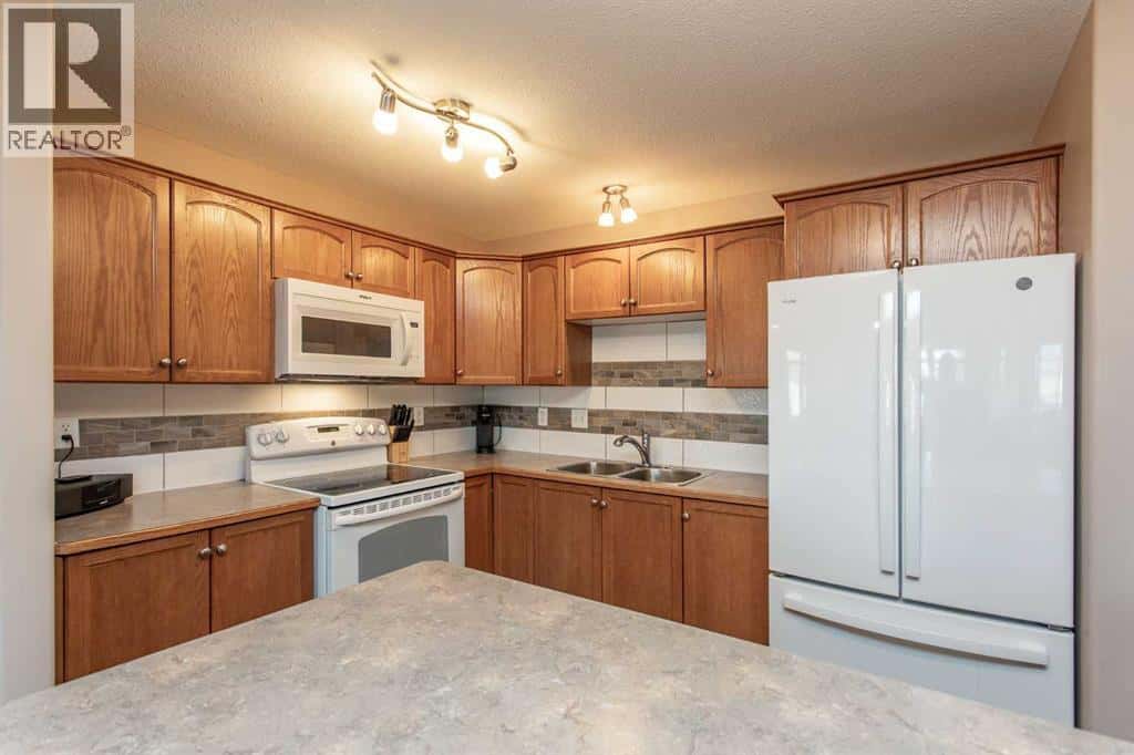 202, 4425 HERITAGE Way — Lacombe, Alberta - Photo 4 of 21