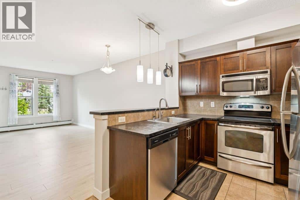 110, 205 Sunset Drive — Cochrane, Alberta - Photo 2 of 23