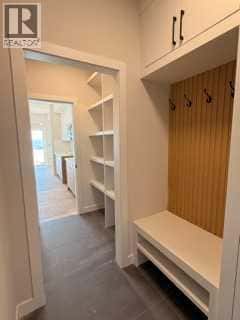 516 Heritage Boulevard — Cochrane, Alberta - Photo 4 of 31