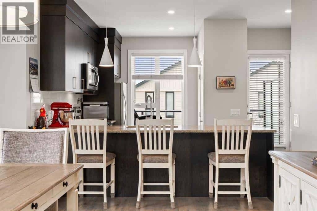 512 Drake Landing Wynd — Okotoks, Alberta - Photo 3 of 39