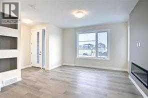 63 Lambeau Lane SE — Airdrie, Alberta - Photo 4 of 16