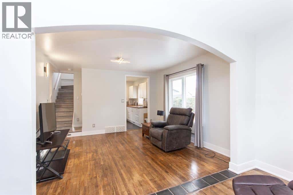 5919 52 Avenue — Red Deer, Alberta - Photo 5 of 44