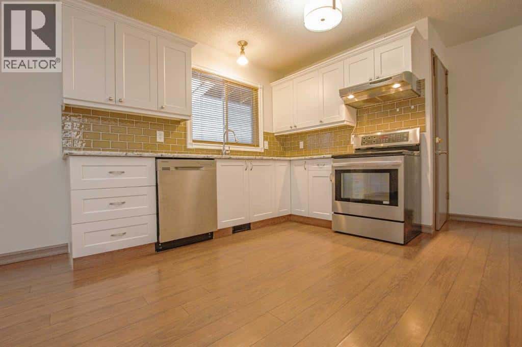 9606 92A Street — Grande Prairie, Alberta - Photo 4 of 28