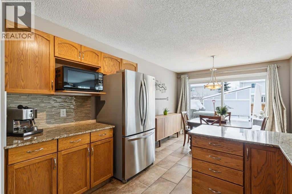 33 River Rock Crescent SE — Calgary, Alberta - Photo 3 of 42