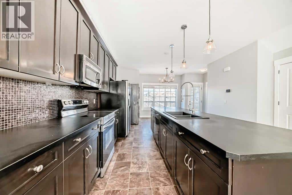 397 Rainbow Falls Drive — Chestermere, Alberta - Photo 5 of 36