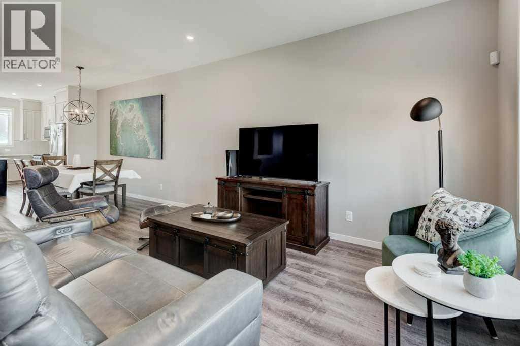 100 Dawson Drive — Chestermere, Alberta - Photo 3 of 35