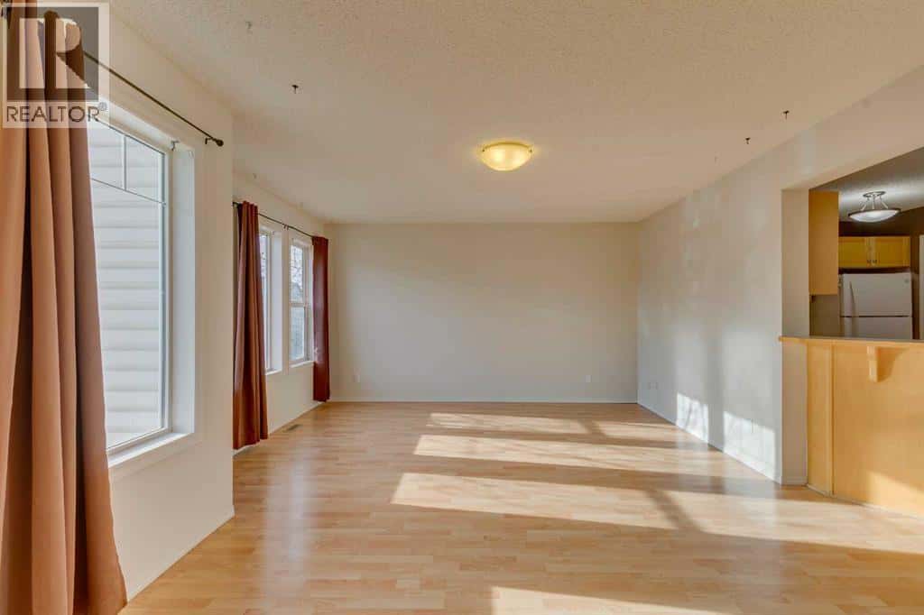 228 Luxstone Place SW — Airdrie, Alberta - Photo 4 of 33