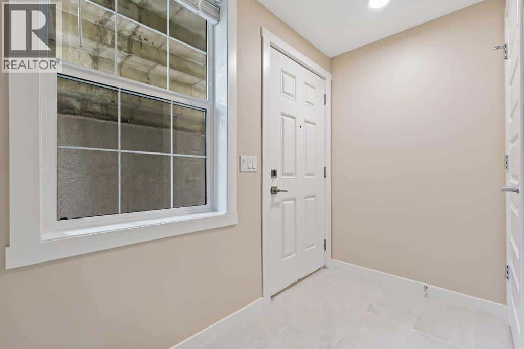 147 Mckenzie Towne Close SE — Calgary, Alberta - Photo 4 of 42