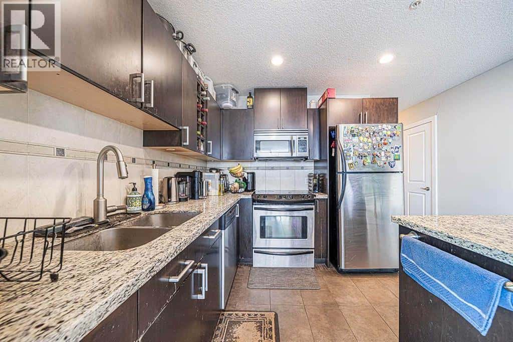 2102, 77 Spruce Place SW — Calgary, Alberta - Photo 4 of 28