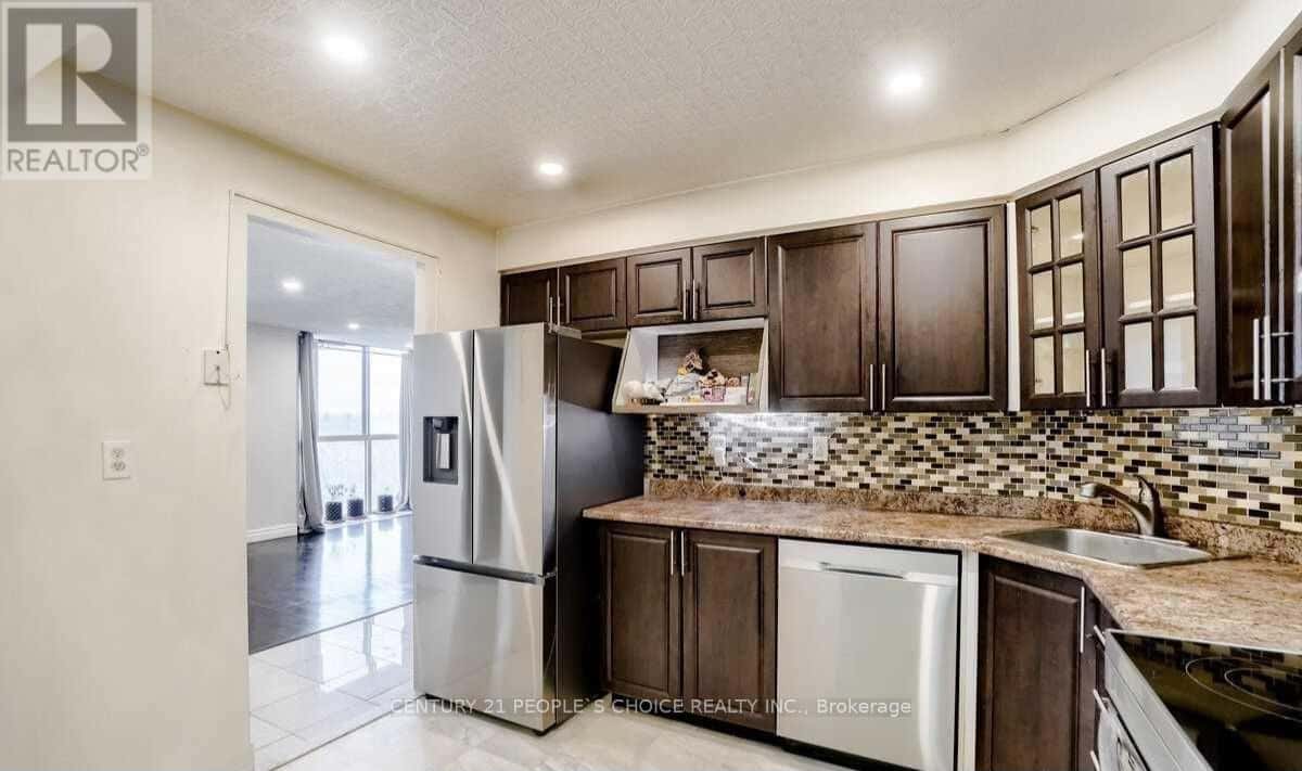 411 - 41 MARKBROOK LANE — Toronto (Mount Olive-Silverstone-Jamestown), Ontario - Photo 2 of 24