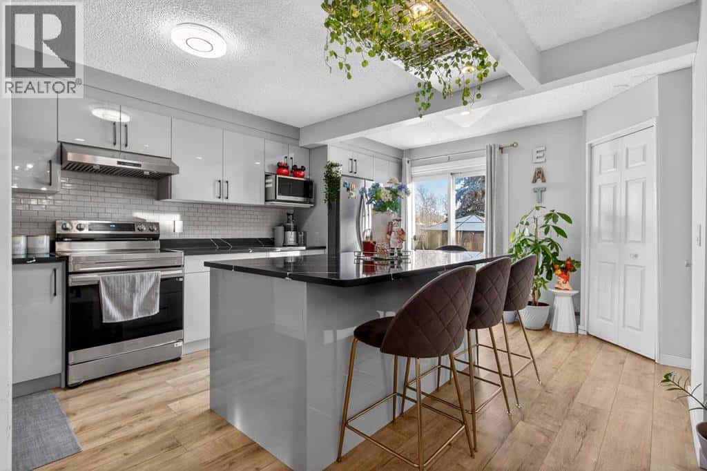 77 Summerfield Road SE — Airdrie, Alberta - Photo 3 of 47