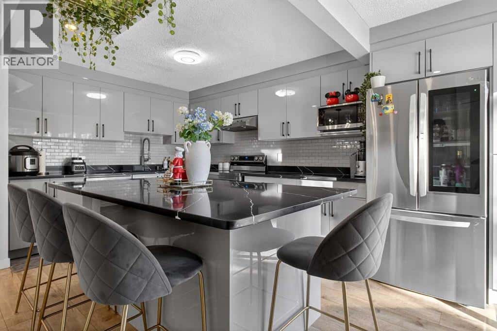 77 Summerfield Road SE — Airdrie, Alberta - Photo 4 of 47