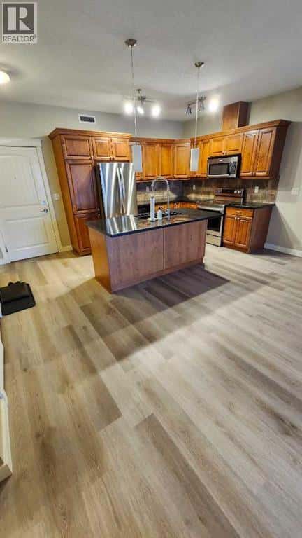 103, 4707 50 Street — Sylvan Lake, Alberta - Photo 4 of 21