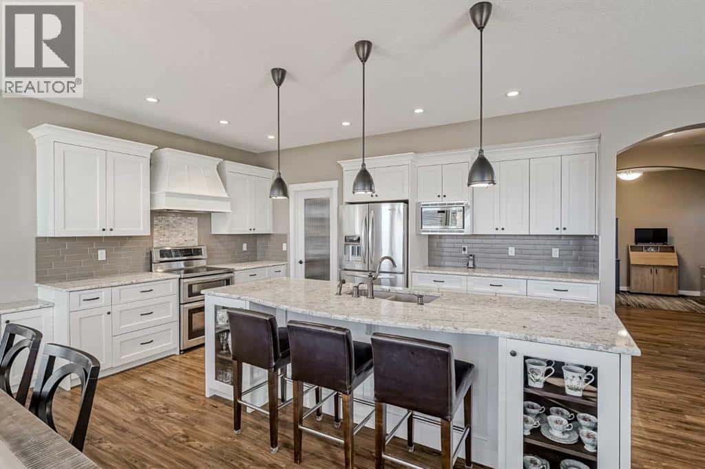 60 Sheep River Heights — Okotoks, Alberta - Photo 2 of 50