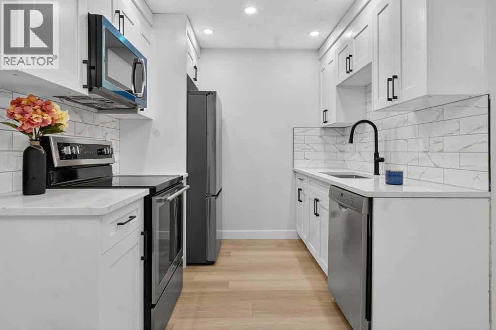 25, 6100 4 Avenue NE — Calgary, Alberta - Photo 5 of 31