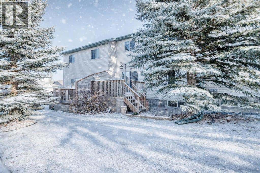 8, 122 Bow Ridge Crescent — Cochrane, Alberta - Photo 2 of 36